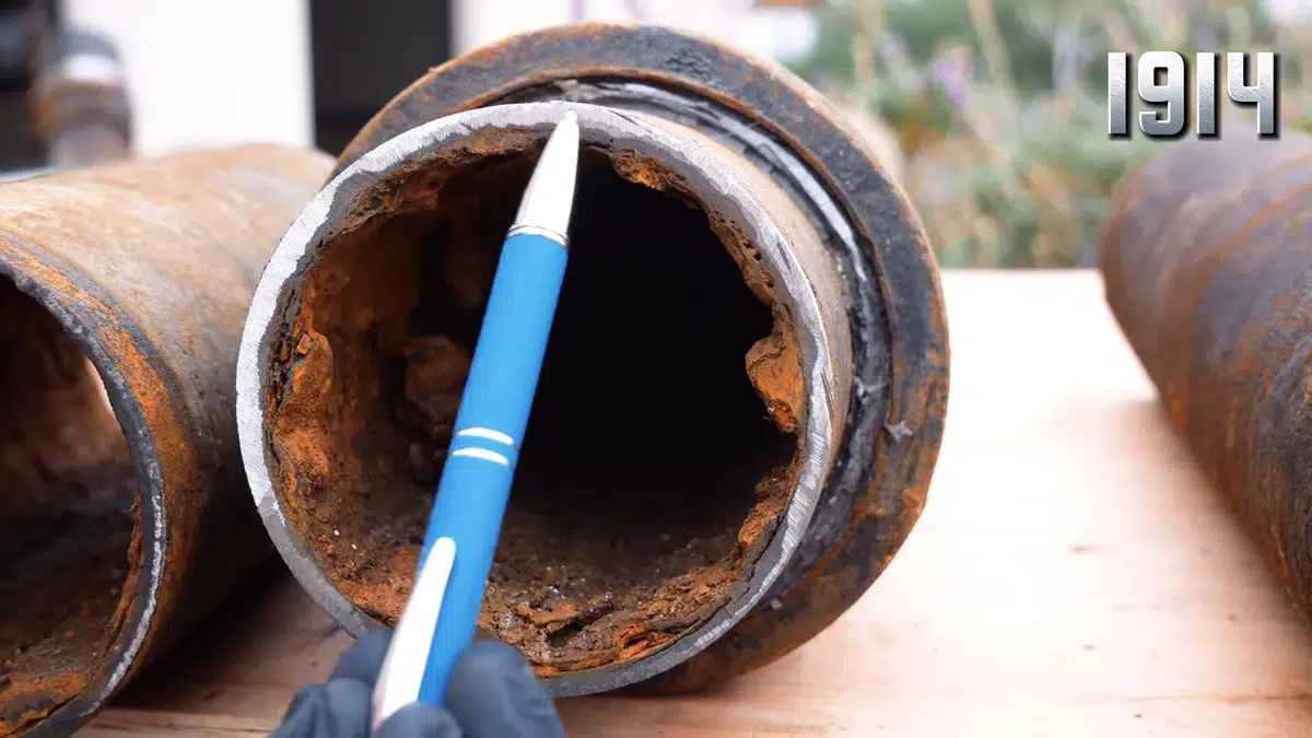 Corroded cast iron drain pipe showing rust and interior wear for Why Bellflower Homes Built Before 1970 Have Orange Water