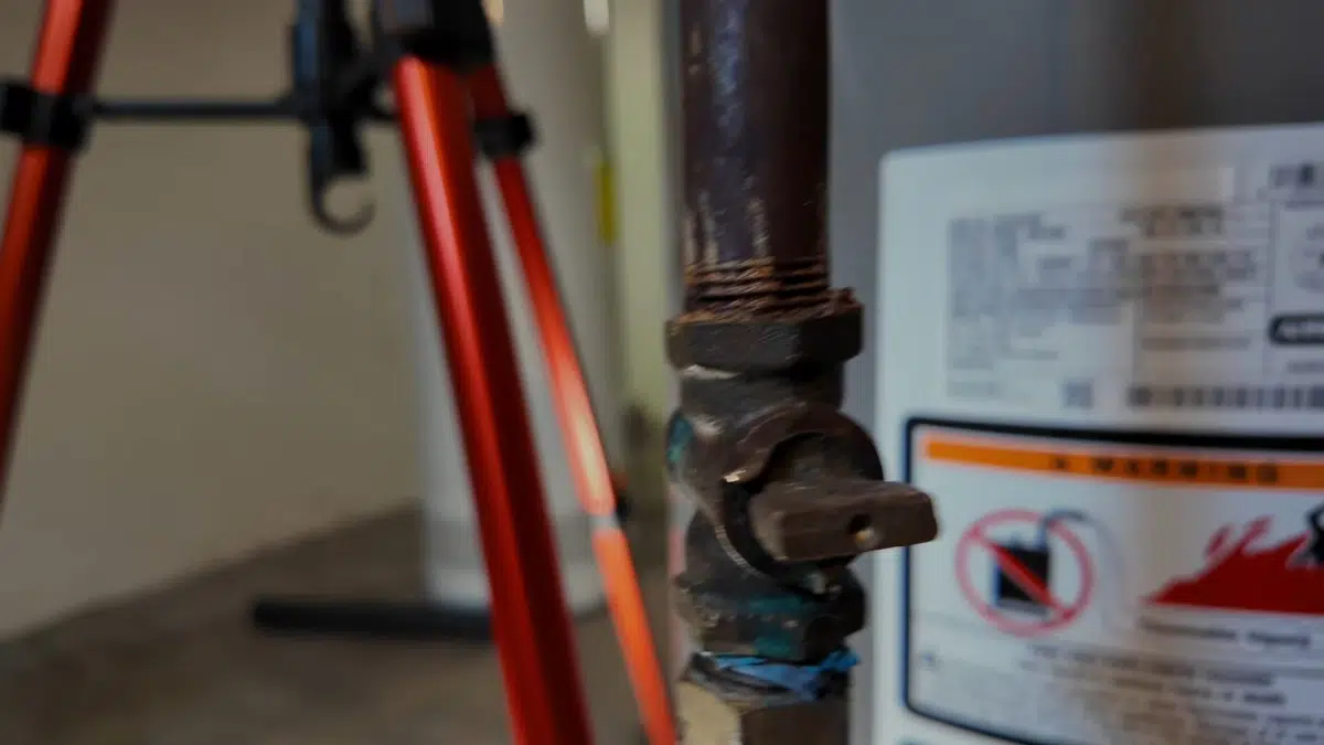 Gas water heater connections being installed and checked for Gas Line Installation & Repair in Bellflower, CA