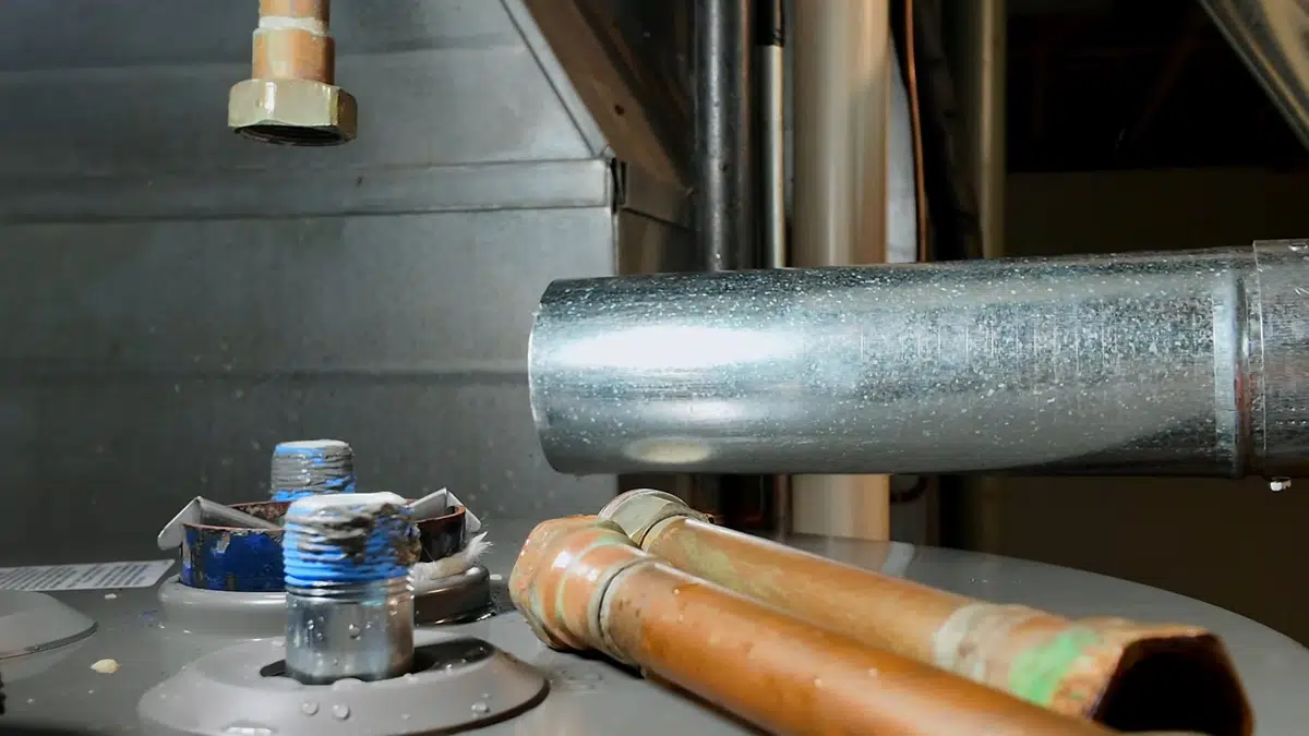 Gas water heater connections being installed and checked for Water Heater Installation & Replacement in Bellflower, CA alternate angle