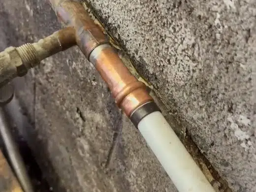 Underground water service line exposed near soil and landscaping for Plumbing Service Areas in Index.Html service access view