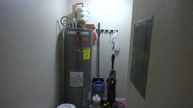 Water heater tank and connection area during inspection for Plumbing Tips and Guides detail view